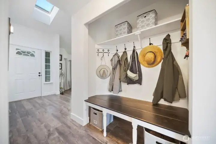 Entryway bench, hooks, and storage for organization