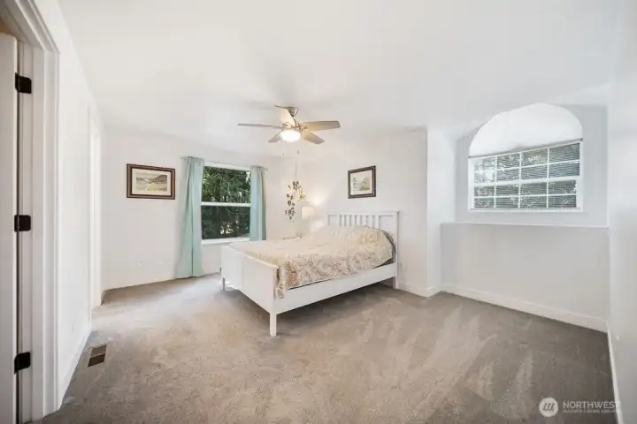 Clean and light primary bedroom