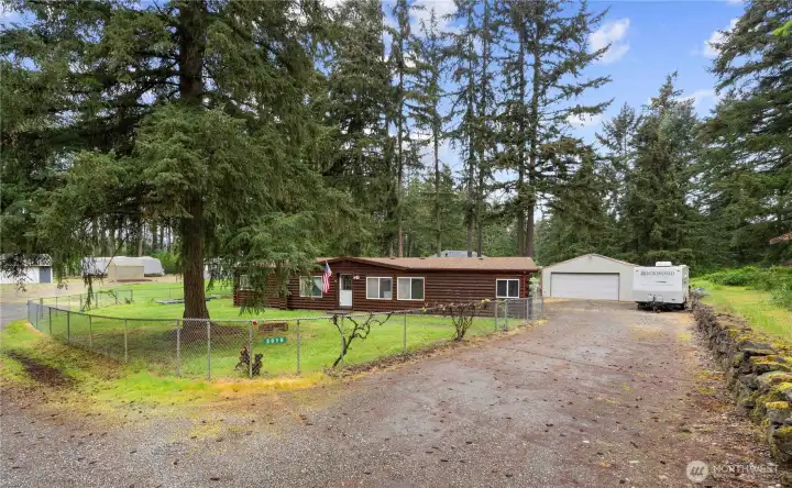 WELCOME HOME to 0.52 Acres in Spanaway on a corner lot!