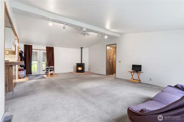 ENTRY: View into the Living Room from the Front Entry. Notice French Doors leading to the Covered Back Deck.