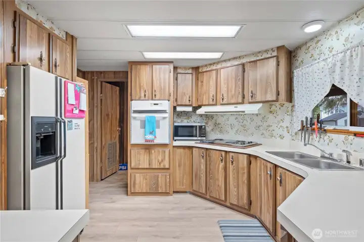 KITCHEN w/Stainless Steel Range Top & Microwave plus Fridge and Wall Oven are also included.