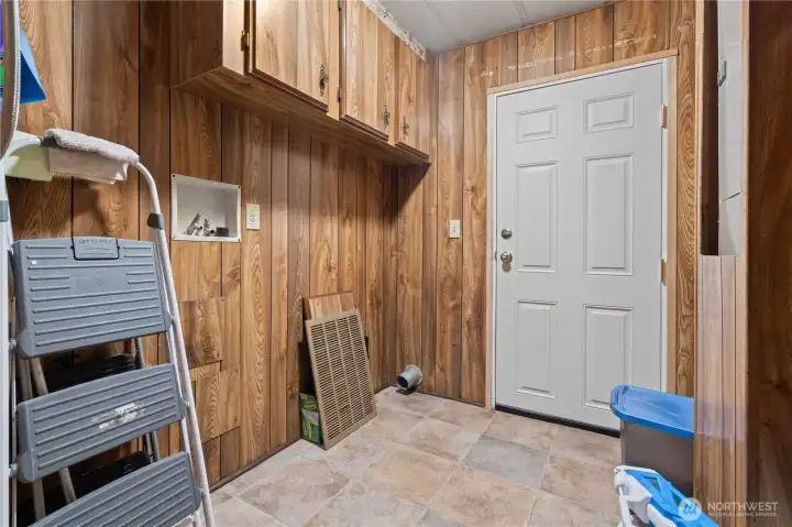 UTILITY ROOM with Washer and Dryer Hookups w/Door to Covered Back Deck. Brand New Back Door!