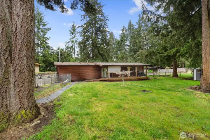 Large 0.52 Lot is setup very well! Shops and Storage Conex are along the driveway side, leaving the rest of the yard free to recreate in!
