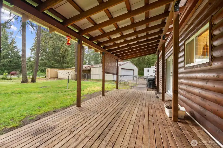 Covered Back Deck with view of the 2-Car Garage, 2-Car Shop, Breezeway and 40' Conex.