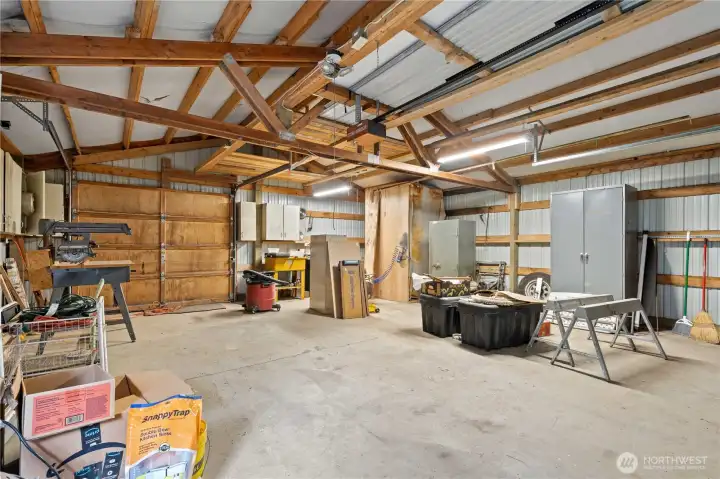2-CAR GARAGE: Interior of the 2-Car Garage facing the Rear Single Garage Door. Lighting and Electrical Outlets included!
