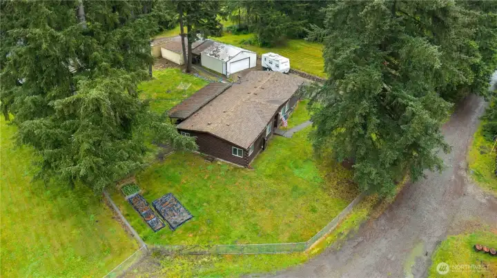 LAND: 0.52 Lot is Fully Fenced and Cross-Fenced with Several Separate Spaces. Gardens are covered from winter still. Room for RV Parking!
