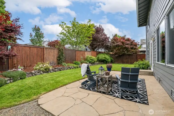 Wonderful level backyard, two large sideyards with dog run & garden space.