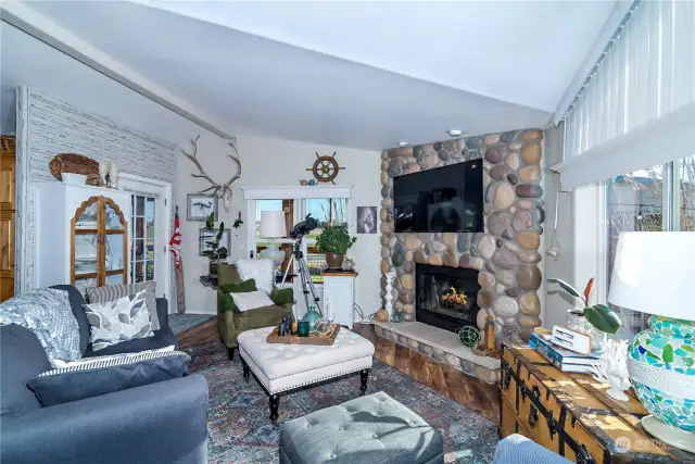 Living room with rock accented fire place.