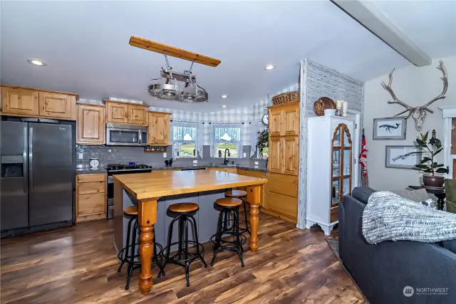 Kitchen with butcher block island.