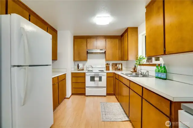 Kitchen cabinets and appliance function well and are in good condition