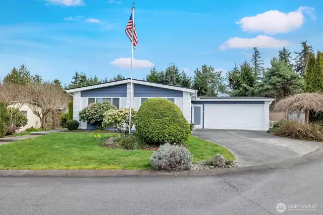 Street view of this well cared for home on a corner lot. Sidewalk from street to formal entry into this well cared for home on a corner lot.