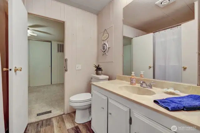 Full guest bathroom has access door from utility room or guest bedroom.