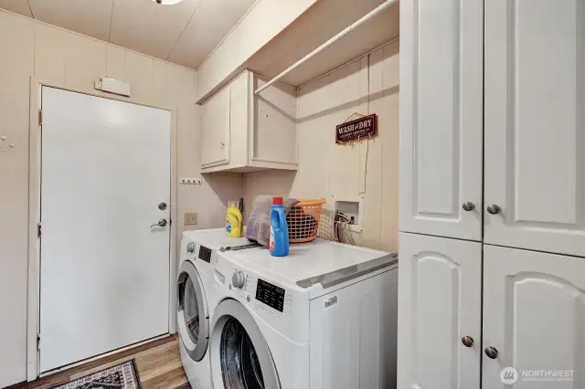 Utility room has storgate cabinets for your laundry and all your cleaning accessoires. Access door into the garage for your convenience.