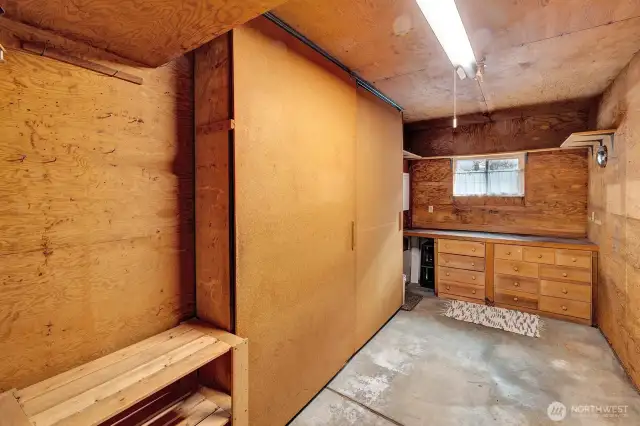 Separate shop room with built in storage also in the garage.