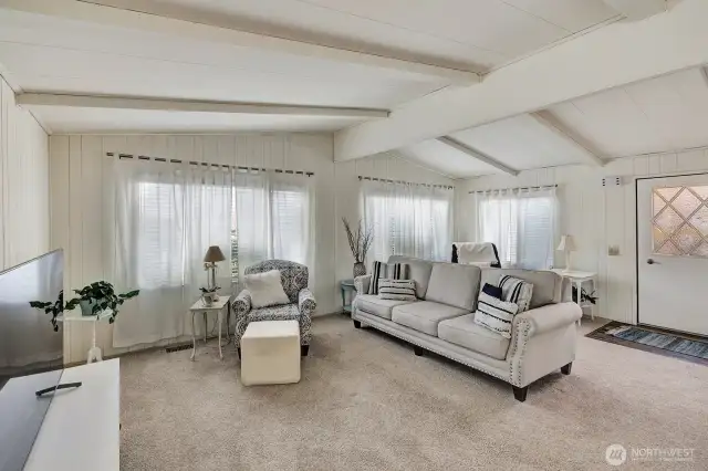 Generous sized formal living room has vaulted ceilings and 3 large windows the bring in plenty of natural lighting all day.