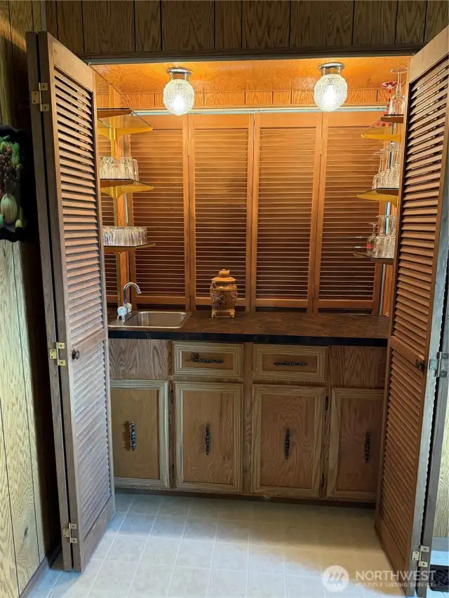Bar opens from dining room into the living room.