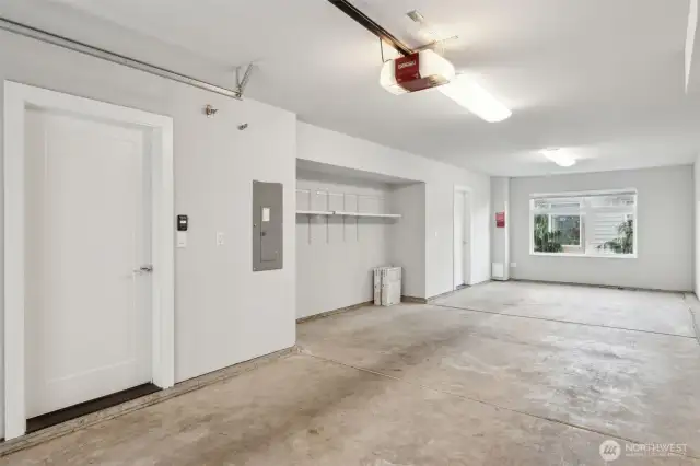 Tandem 2-car garage with a large window at the end, perfect for a workout area