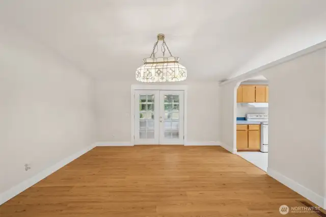 Roomy dining room area. The double doors lead to the enclosed porch.