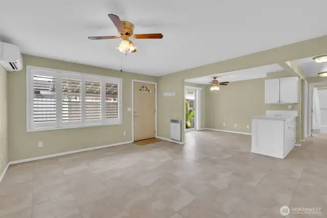 Living room with ceiling fan and mini split to stay warm in the winter and cool in the summer.