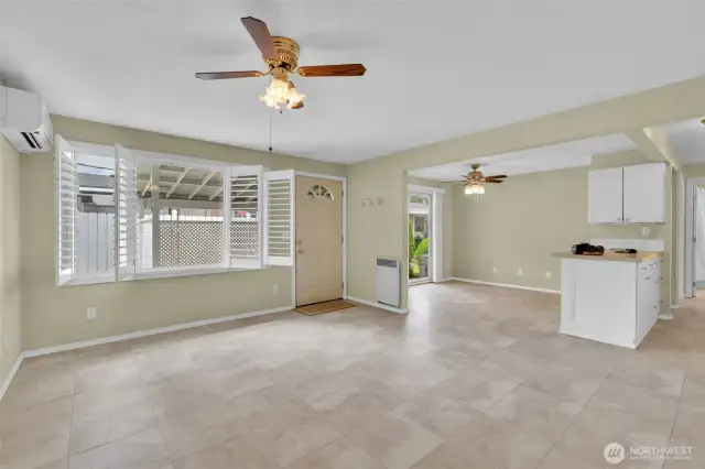 Living room with the faux wood shutter blinds open.