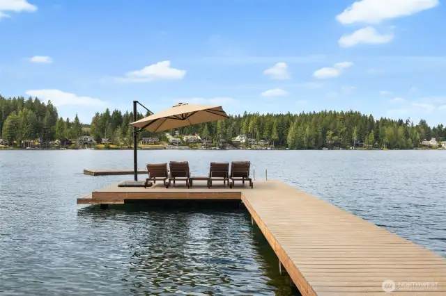 Spacious, newly built Trex dock with deep water moorage is ready for your boat.  A rare year-round set up most spots on the lake can't offer.