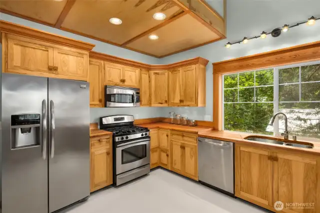 Hickory cabinets bring warmth and character to the light-filled kitchen.