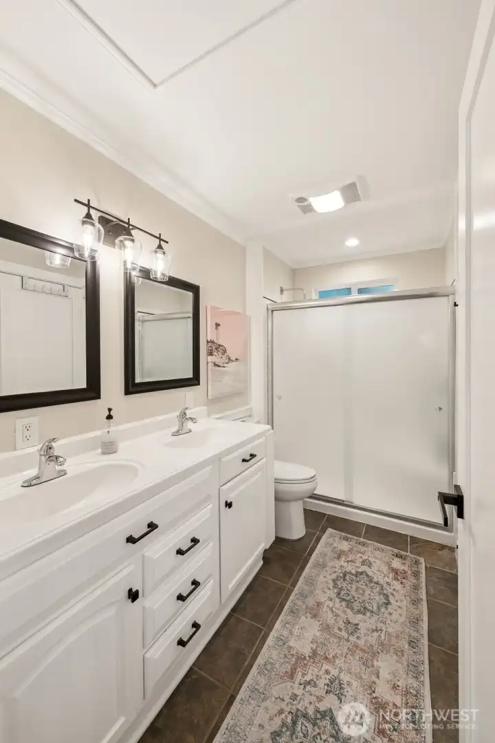 Attached 3/4 bathroom with large double vanity.