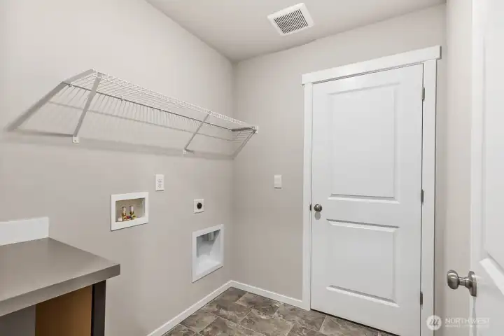 Photo is of a similar home. Colors and materials may vary.