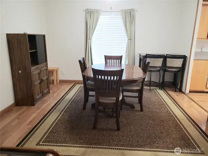 Entertainment Size Dining Room with Laminate Flooring.