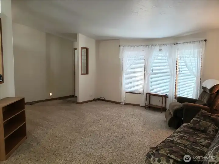 A Different Picture of the Huge Living Room from the Dining Room Looking at the Front Door..