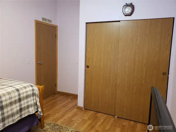 Another View of the Good Size Second Bedroom with Laminate Flooring and Large Closet.