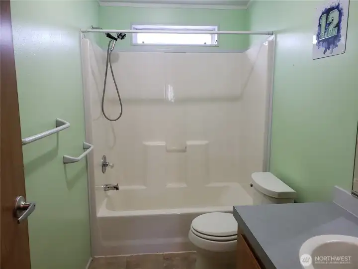 Large Size Main Guest Bath Room Showing Tub Shower.