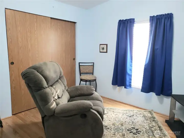 Another Picture of the Good Size Third Bedroom with Laminate Flooring and Large Closet.
