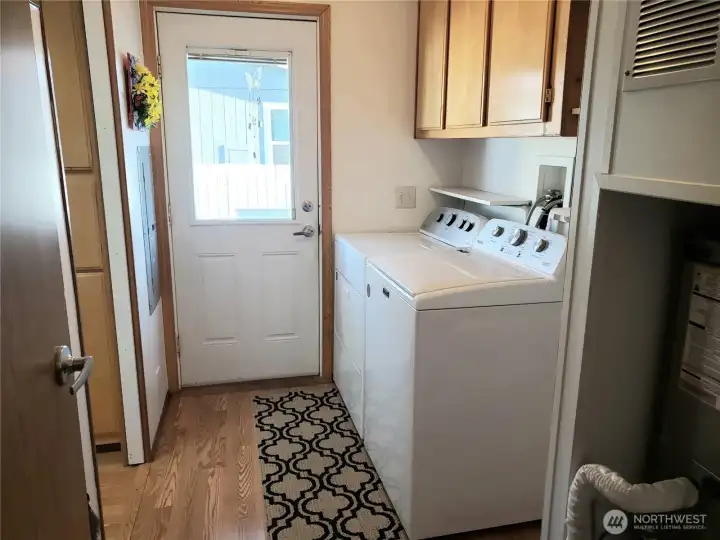 Large Utility Room with Newer Washer and Dryer.