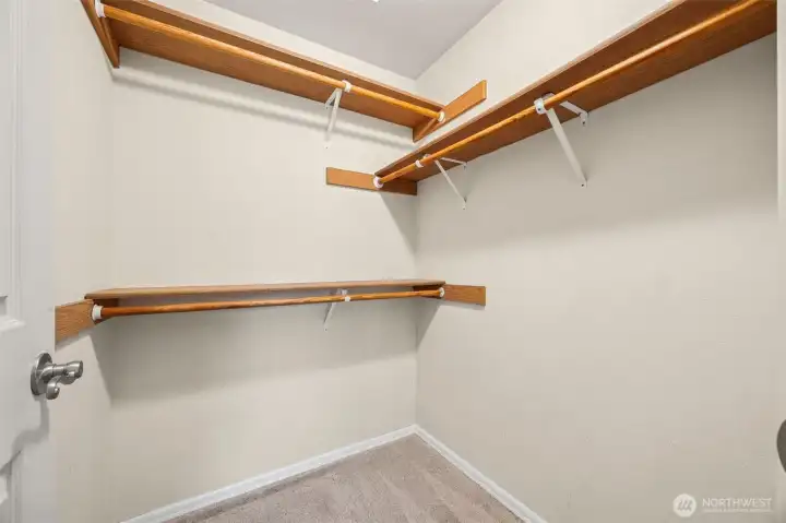 Primary suite walk-in closet with several options for better use of space.