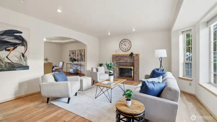 Perfect for gatherings or quiet evenings, this front sitting room offers warmth, style, and easy flow into the dining area.