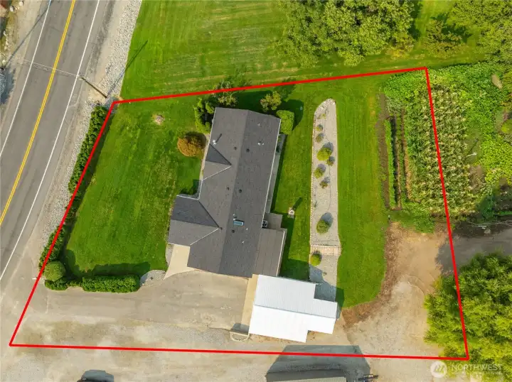 Approximate lot lines. Dirt corner behind garage is easement.
