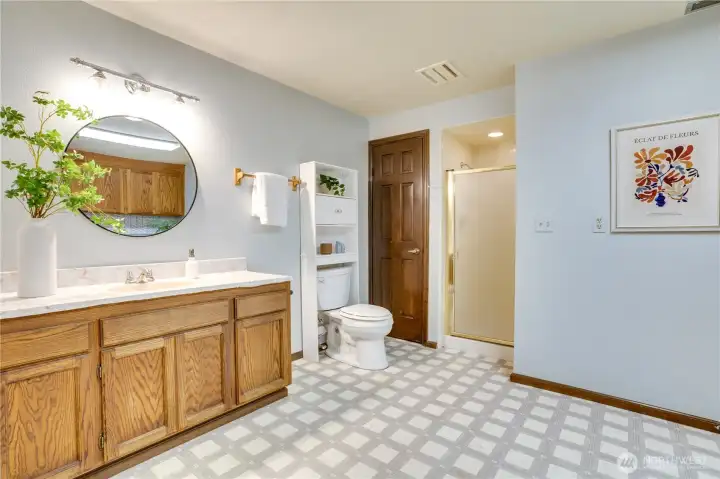 Downstairs 3/4 bathroom and laundry has extra space for storage, crafts, and projects.