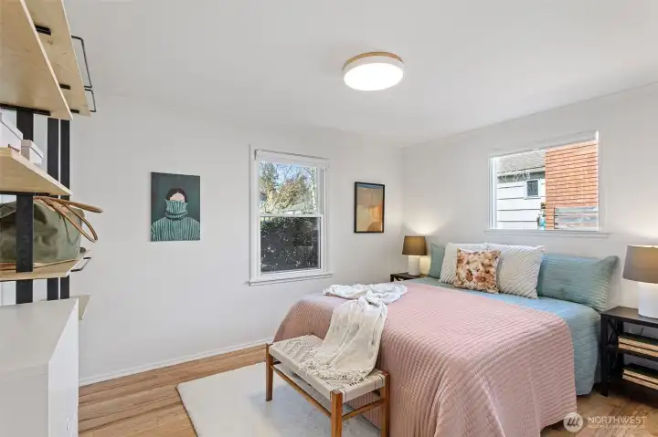 Primary bedroom with custom shelving and custom soft close closet door