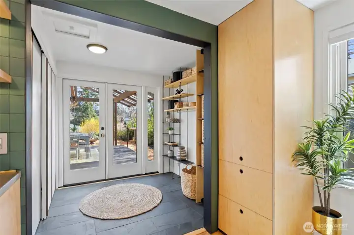 Detail shot of french doors leading to covered deck and backyard