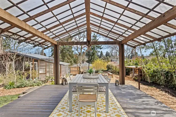 Welcome to your impressive covered deck leading you to this private and serene garden oasis