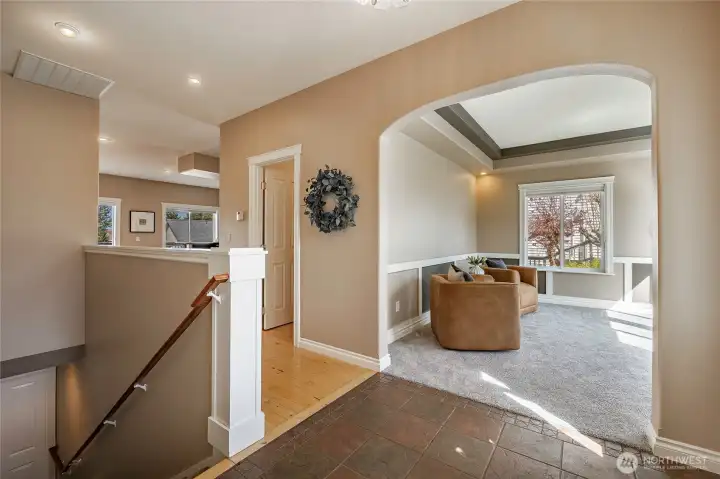 Entry looking at office/den and staircase, guest bath is in the hall