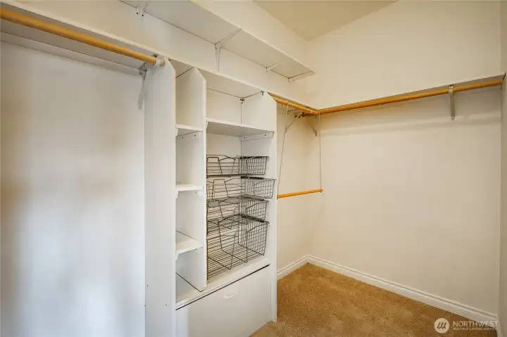 Primary bedroom walk-in closet