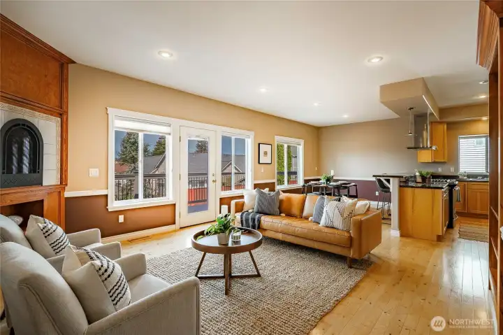 Living room with gas FP and built-in custom shelving with access to the deck