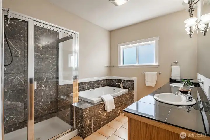 Primary ensuite - jetted tub, separate shower double vanity, granite