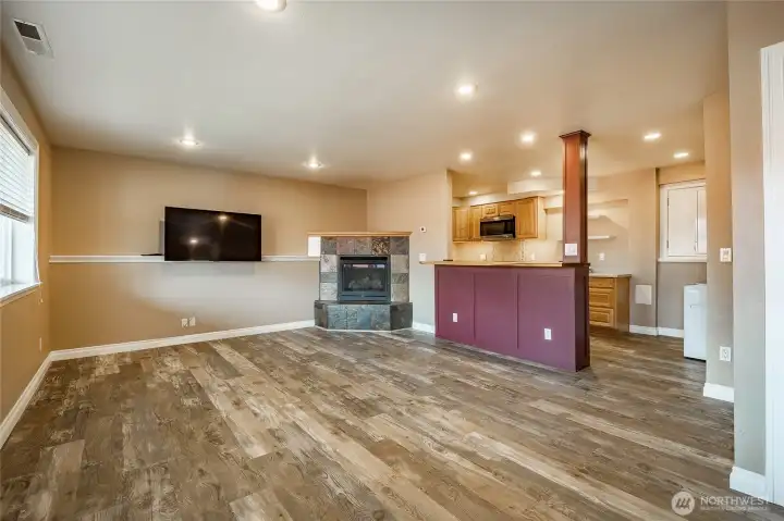 Lower level - Family room with gas FP and open to Kitchen