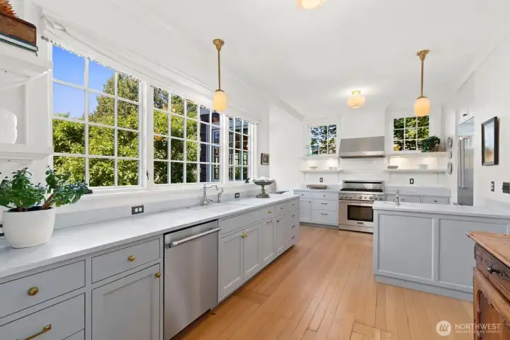 Completely re-imagined kitchen overlooks a verdant back yard. Custom, marble-topped cabinets with a suite of Thermador appliances, a pantry, and an abundance of counter space welcomes your chef, or someone small looking for a glass of juice. This kitchen feels right! Completely re-imagined kitchen overlooks a verdant back yard. Custom, marble-topped cabinets with a suite of Thermador appliances, a pantry, and an abundance of counter space welcomes your chef, or someone small looking for a glass of juice. This kitchen feels right!