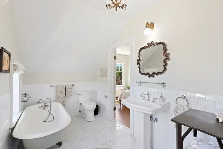 Second full bath on bedroom level. Marble tiled floors seemingly glitter in the sunlight. Second full bath on bedroom level. Marble tiled floors seemingly glitter in the sunlight.