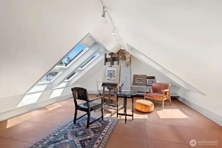 On the third floor a finished art loft provides a rare and inspiring flex space. Light flows in through large skylights and other casement windows. On the third floor a finished art loft provides a rare and inspiring flex space. Light flows in through large skylights and other casement windows.