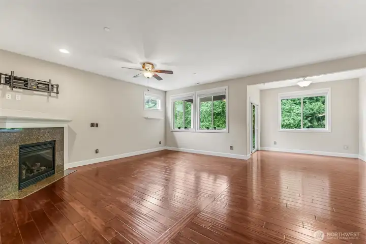 Gleaming floors and wooded wetland view.